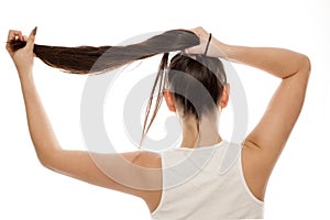 Woman holding her hair