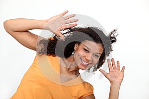 Woman holding her hands up