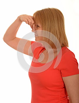 Woman holding her nose