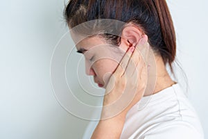 Woman holding her painful Ear. Ear disease, Atresia, Otitis Media, Inflation, Pertorated Eardrum, Meniere syndrome,