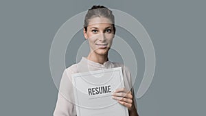 Woman holding her resume