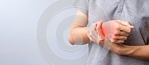 Woman holding her wrist pain because using smartphone or computer long time. De Quervain s tenosynovitis, Intersection Symptom,
