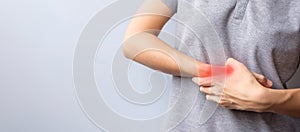 Woman holding her wrist pain because using smartphone or computer long time. De Quervain s tenosynovitis, Intersection Symptom,