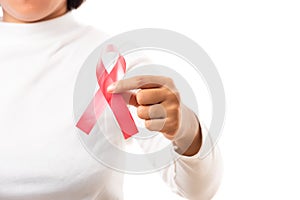 Woman holding HIV AIDS awareness red ribbon