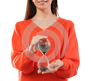 Woman holding hourglass on white background. Time management concept