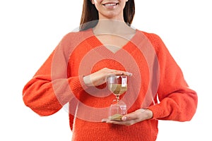 Woman holding hourglass on white background. Time management concept