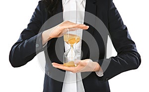 Woman holding hourglass on white background. Time management concept