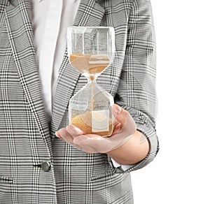 Woman holding hourglass on white background. Time management concept