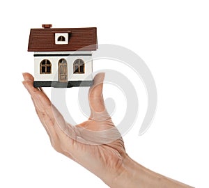 Woman holding house model