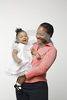 Woman holding infant girl.