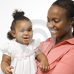 Woman holding infant girl.