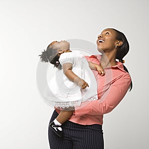 Woman holding infant girl.