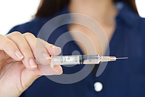 Woman holding an injection