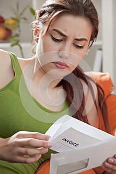 Woman holding invoice envelope