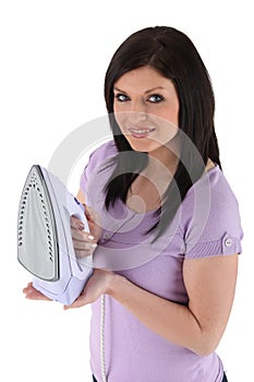 Woman holding an iron