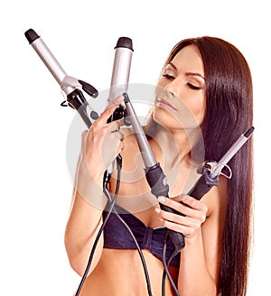 Woman holding iron curling hair
