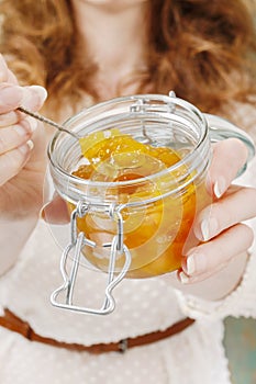 Woman holding jar of jam