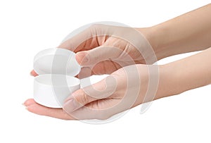 Woman holding jar of petroleum jelly on white background, closeup