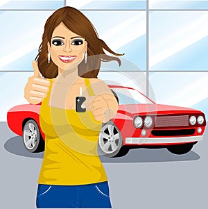 Woman holding the key and showing thumbs up