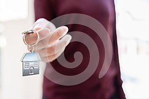 Woman holding keychains house key photo