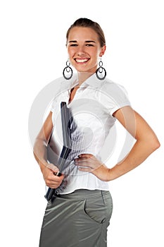 Woman holding laptop with hand on hip.
