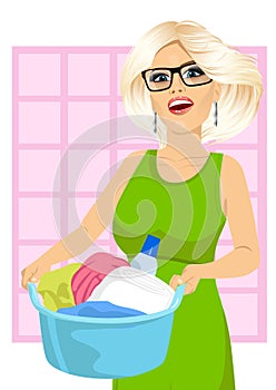 Woman holding a laundry basket full of dirty clothes