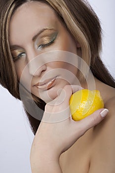 Woman holding a lemon