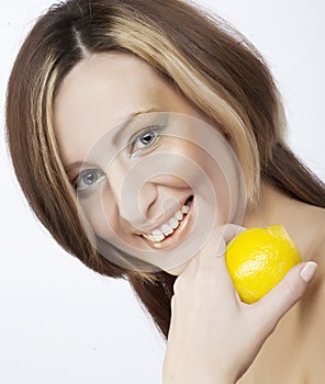 Woman holding a lemon