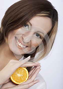 woman holding a lemon
