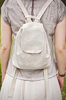 Woman holding linen backpack bag. Template mock up photo