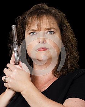 Woman holding loaded gun