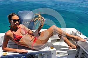 Woman holding a lobster
