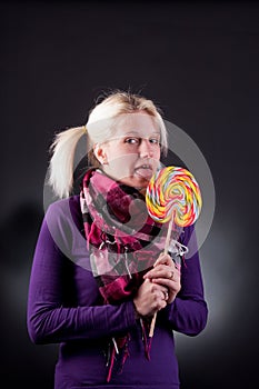 Woman holding lollypop