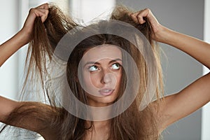 Woman With Holding Long Damaged Dry Hair. Hair Damage, Haircare.