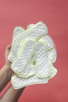 Woman holding a lot of panty liners