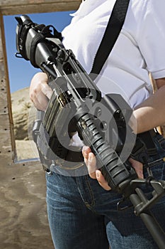 Woman Holding Machine Gun At Firing Range