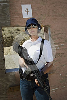 Woman Holding Machine Gun At Firing Range