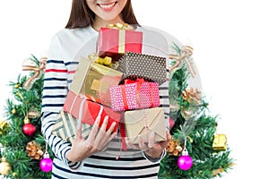 A woman holding many of gift boxes over white