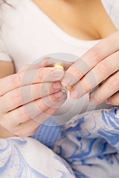 Woman holding medical pills