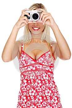 Woman holding a micro four thirds photo camera.