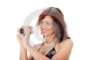 Woman holding a micro four thirds photo camera.