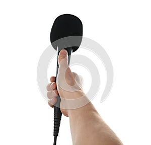 Woman holding microphone on white background