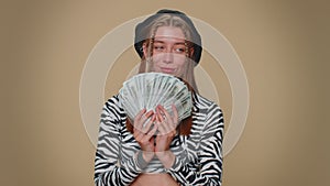 Woman holding money dollar cash like a fan, success business career, lottery winner, income, wealth