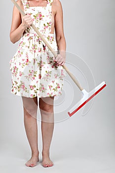 Woman holding a mop