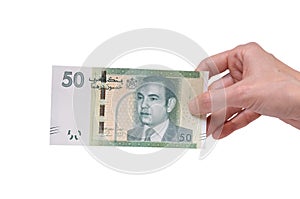 Woman holding a 50 Moroccon Dirham banknote in her hand on a white background photo