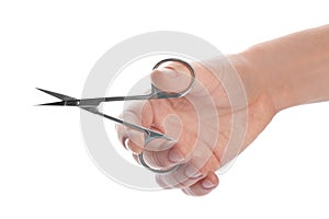 Woman holding nail scissors on white background