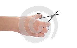 Woman holding nail scissors on white background