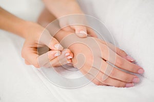 Woman holding a needle in an acupuncture therapy