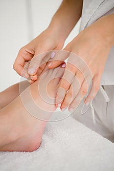 Woman holding a needle in an acupuncture therapy