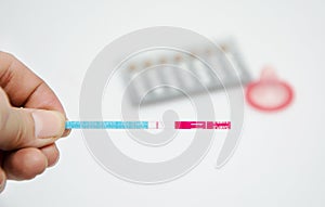 Woman holding negative pregnancy test save